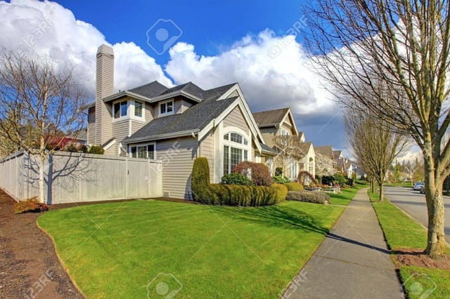 15783883-classic-american-house-in-northwest-and-street-with-fence-in-the-spring.jpg